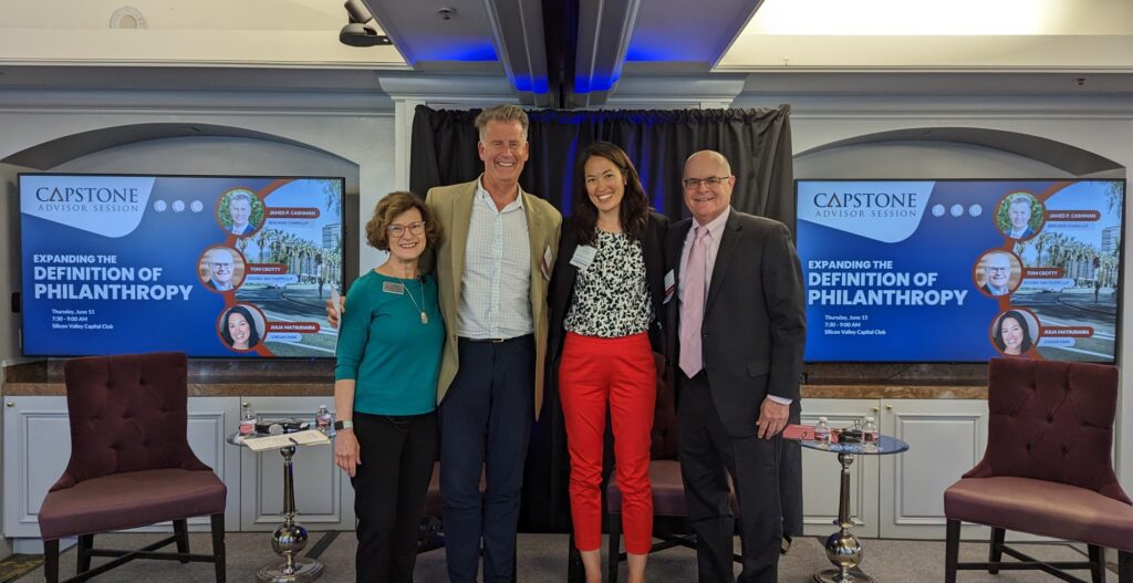 Four speakers from the Capstone Advisor Session on stage smiling