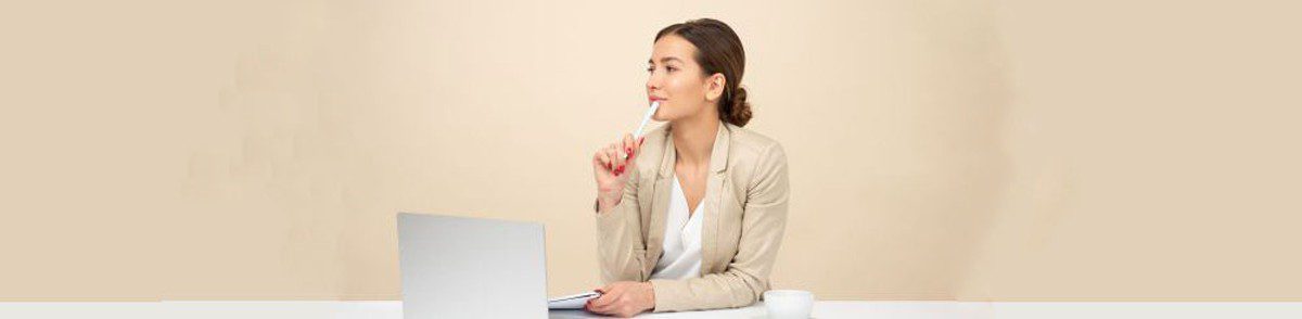 business woman with computer and pen